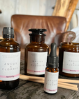 Collection of Angus & Florrie serenity products on a wooden surface with a blurred background.