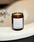Candle labelled 'Angus & Florrie' on a bath