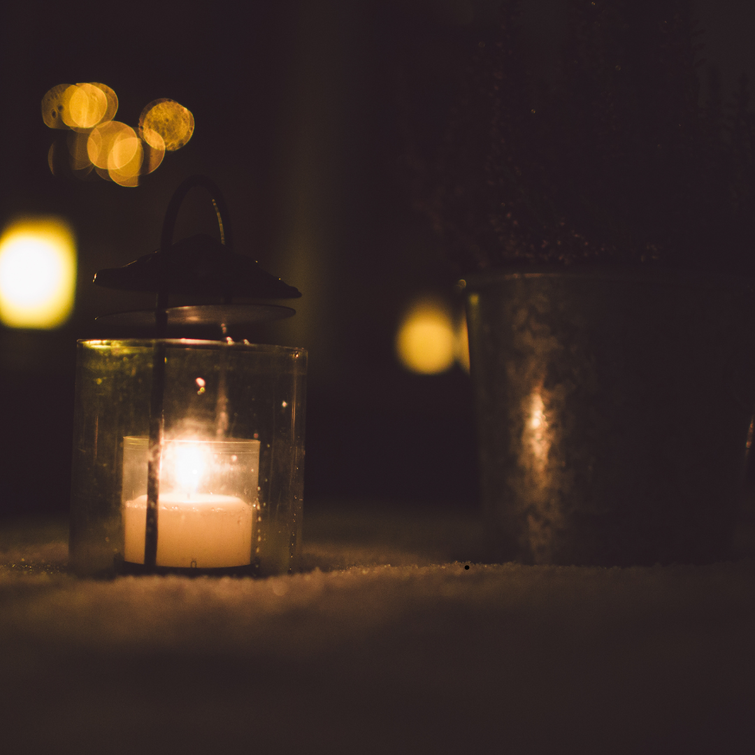 Tea light lit at night time