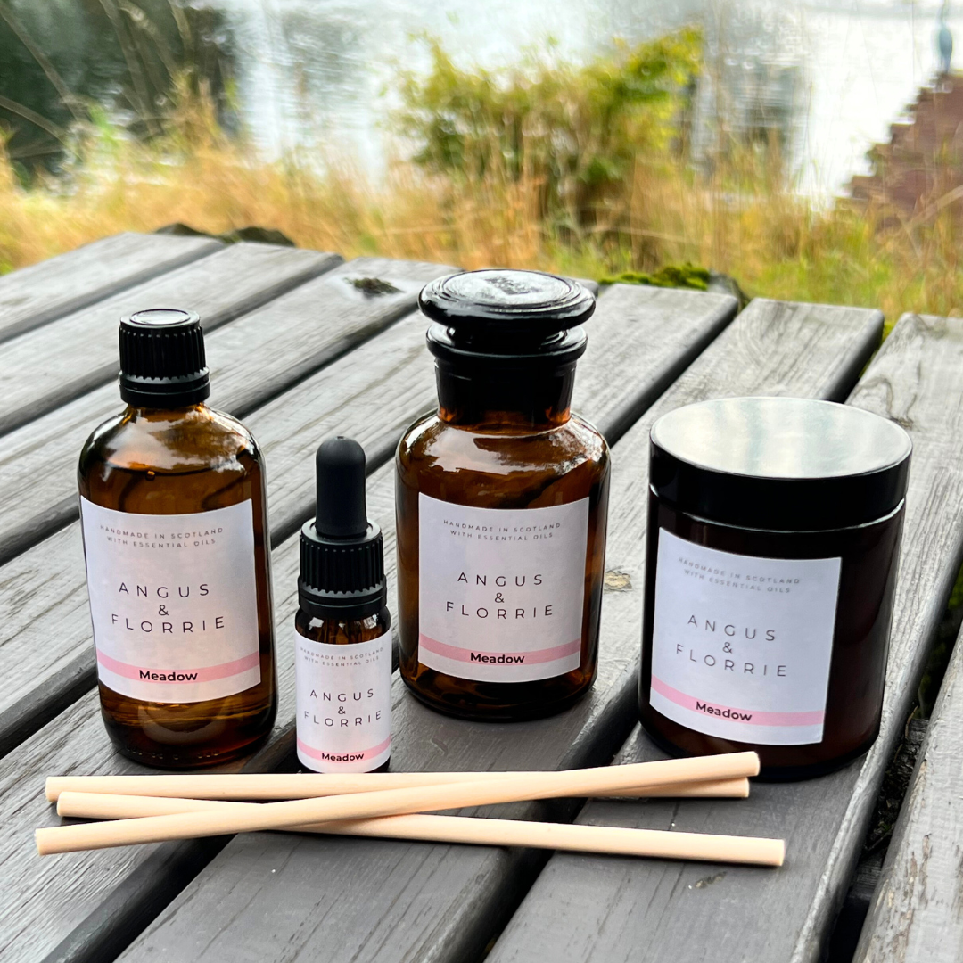 Collection of Angus & Florrie products on a wooden surface with a natural background