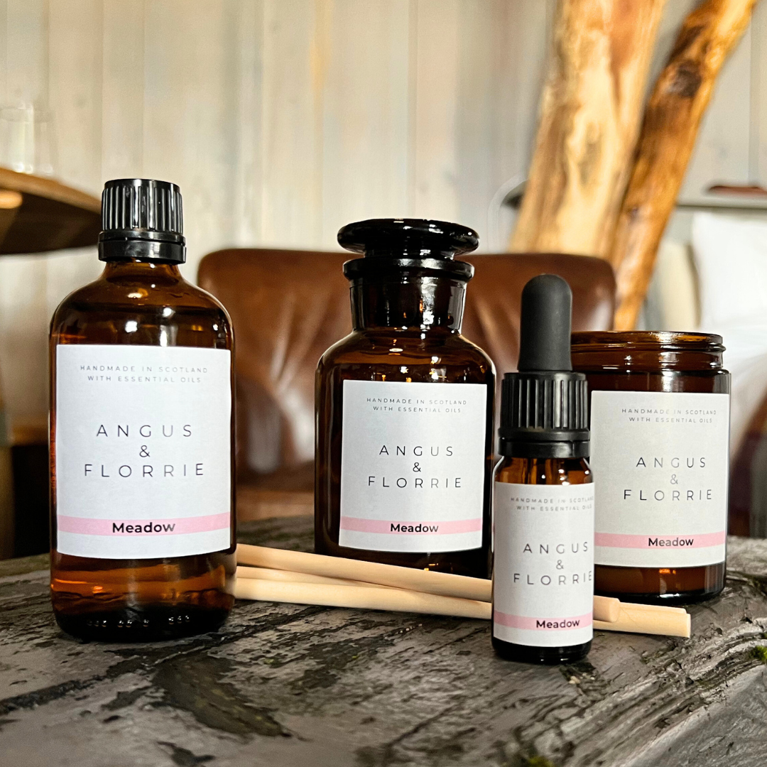 Collection of Angus & Florrie products on a wooden surface with a blurred background